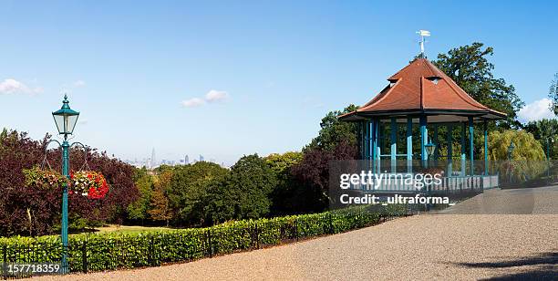 london's distant skyline - bandstand stock pictures, royalty-free photos & images