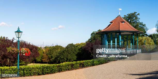 london's distant skyline - broadgate park stock pictures, royalty-free photos & images