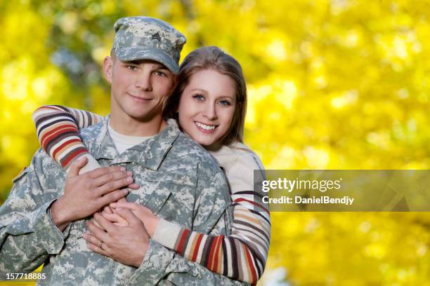 army family series: real american soldier & wife - military spouse stock pictures, royalty-free photos & images