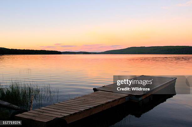 scenic lake and dock at sunset - jetty lake stock pictures, royalty-free photos & images