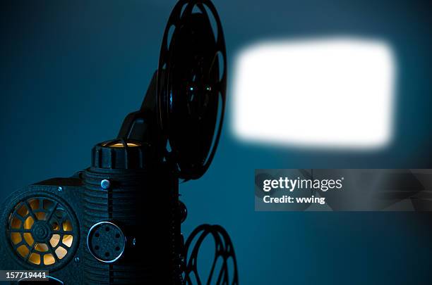 projector and screen - cinema projector stock pictures, royalty-free photos & images