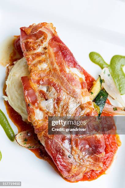 pancetta wrapped sea bass - prosciutto stock pictures, royalty-free photos & images