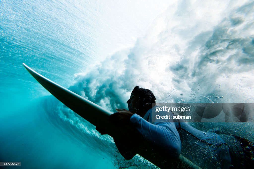 Surfer duck diving