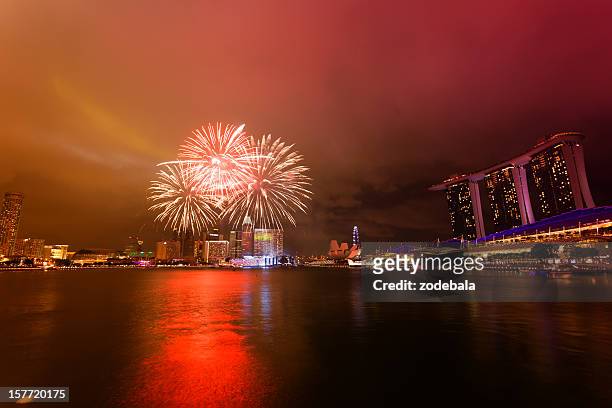 singapore marina bay by night with fireworks - national holiday stock pictures, royalty-free photos & images