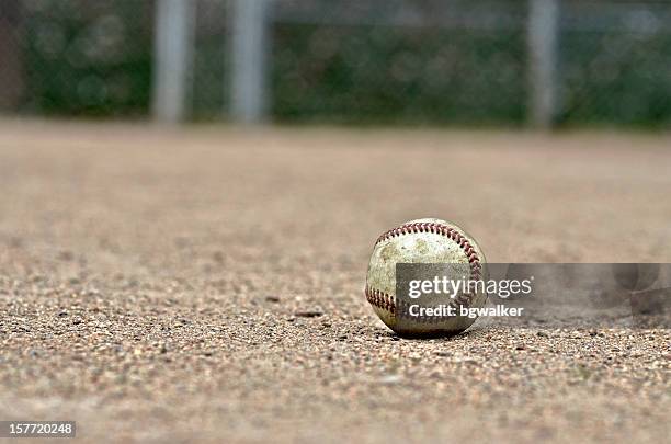 baseball on diamond - baseball texture stock pictures, royalty-free photos & images