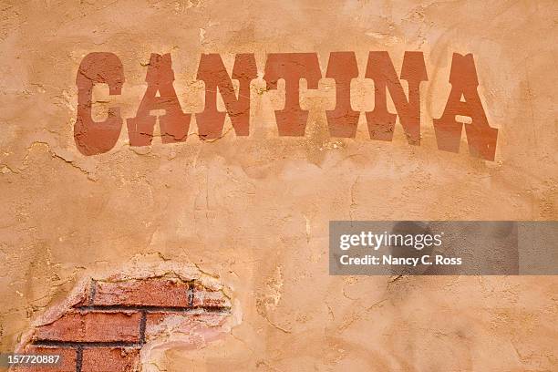 cantina sign outside bar, brick stucco wall, rustic, cinco-de-mayo - cinco de mayo background stock pictures, royalty-free photos & images