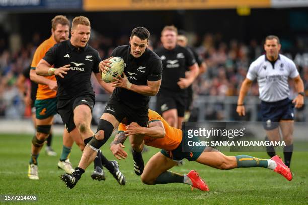 New Zealand's Will Jordan is tackled by Australia's Quade Cooper during the Rugby Championship & Bledisloe Cup Test match between Australia and New...