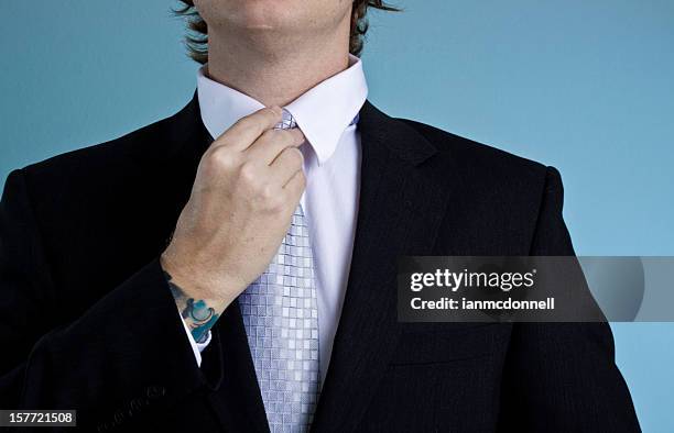 adjusting - adjusting suit stock pictures, royalty-free photos & images