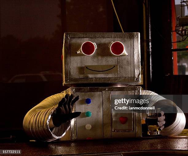 happy roboter in der bar - robot costume stock-fotos und bilder