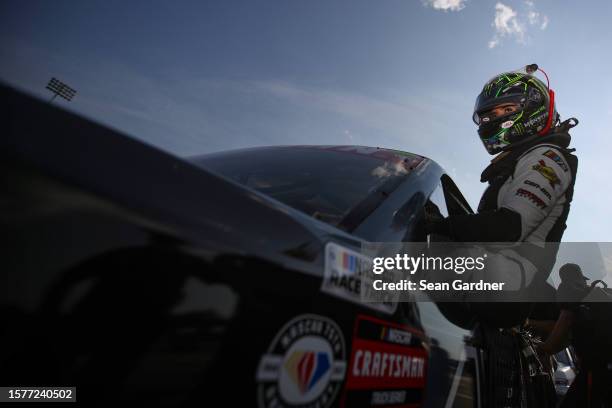 Hailie Deegan, driver of the Ford Performance Ford, enters her truck during qualifying for the NASCAR Craftsman Truck Series Worldwide Express 250 at...