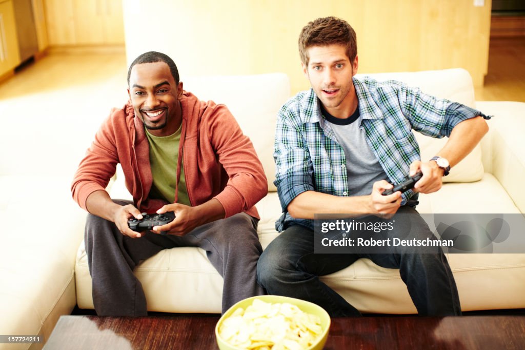 Men playing video games.