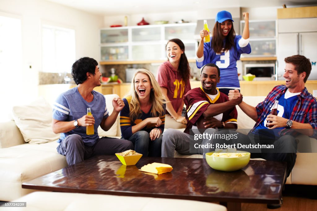 Friends Watching Football in Living Room