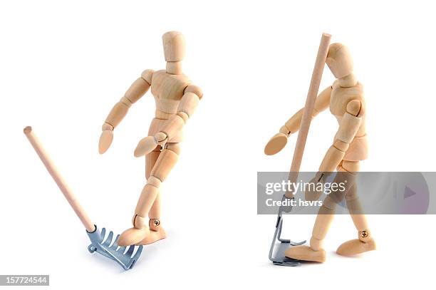 wooden mannequin having accident of work with garden fork - lay figure stock pictures, royalty-free photos & images