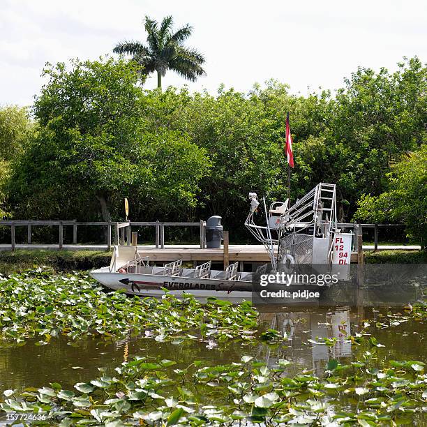 moored airboat in everglades national park - airboat stock pictures, royalty-free photos & images