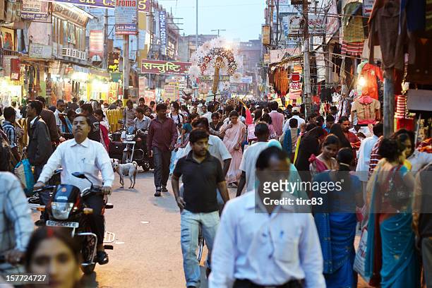 bustling night time market at varanasi, india - india market stock pictures, royalty-free photos & images