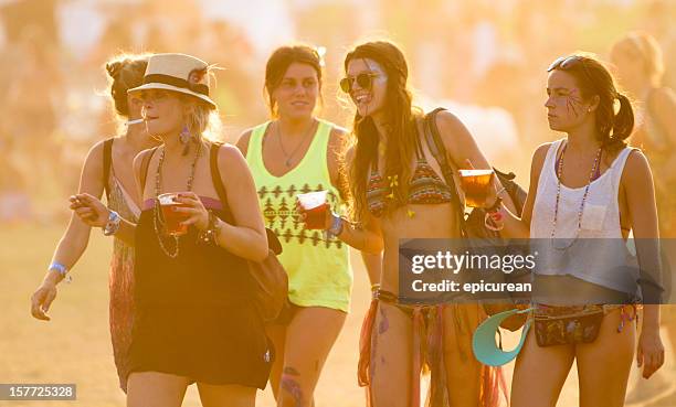 beautiful group of women at a music festival - concert face stock pictures, royalty-free photos & images