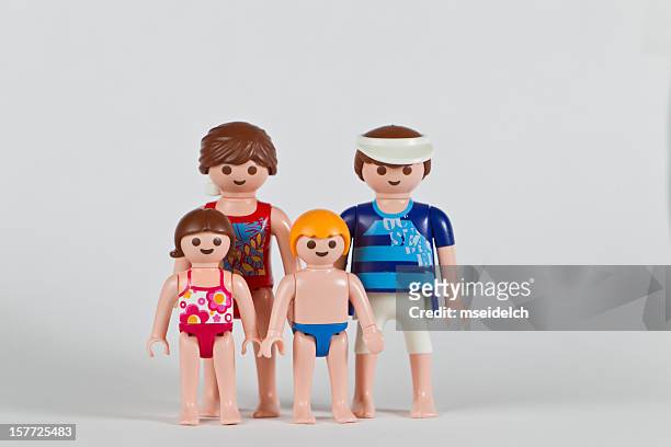 playmobil family, parents, boy and girl child - speedo boy stock pictures, royalty-free photos & images
