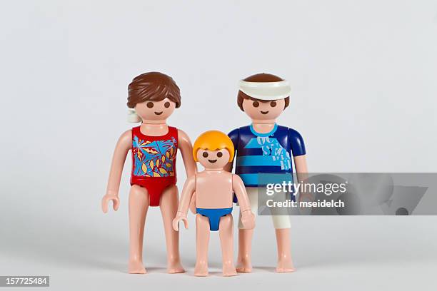 playmobil family, parents and a boy child - speedo boy stock pictures, royalty-free photos & images