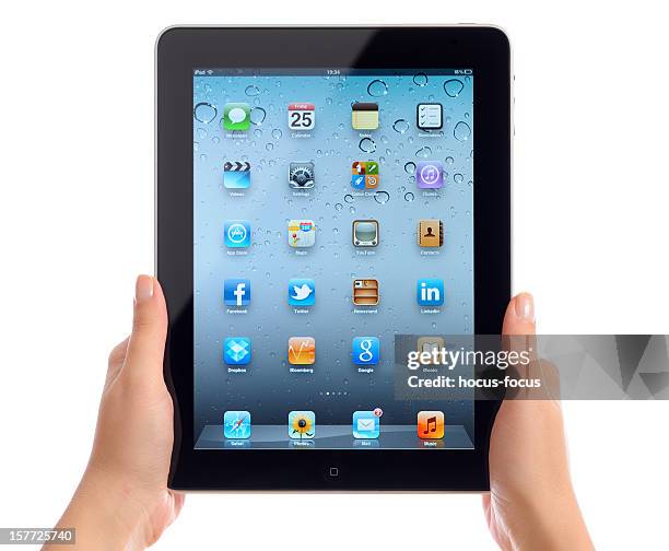 holding apple ipad ios 5 - homescreen stock pictures, royalty-free photos & images