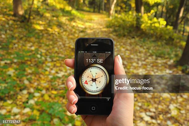 compass on iphone 4 - digital compass stock pictures, royalty-free photos & images