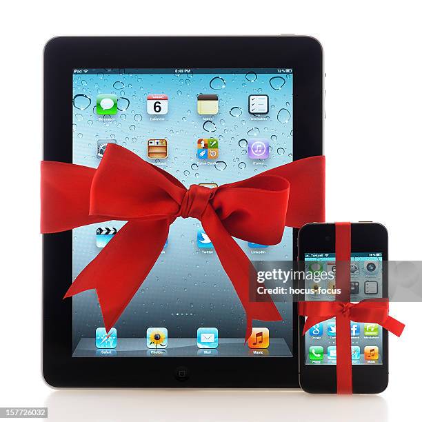 ipad and iphone with red ribbon - homescreen stock pictures, royalty-free photos & images