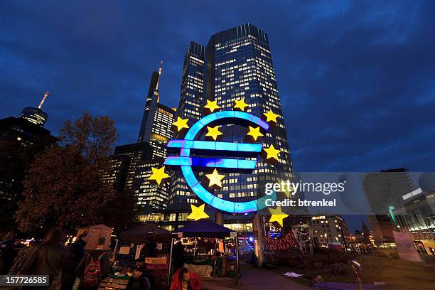 occupy movement &amp; european central bank at dusk - european central bank stock pictures, royalty-free photos & images