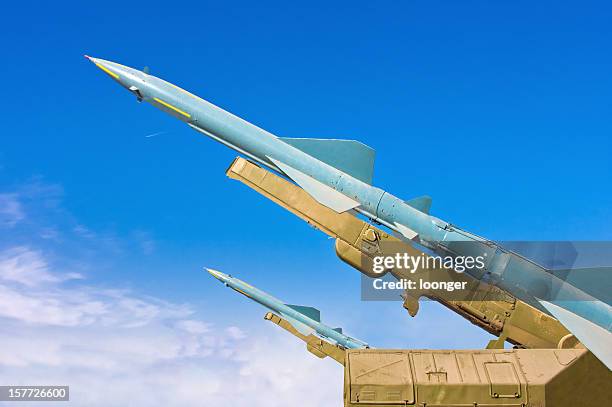 two missiles aimed at the blue sky - china missiles stock pictures, royalty-free photos & images