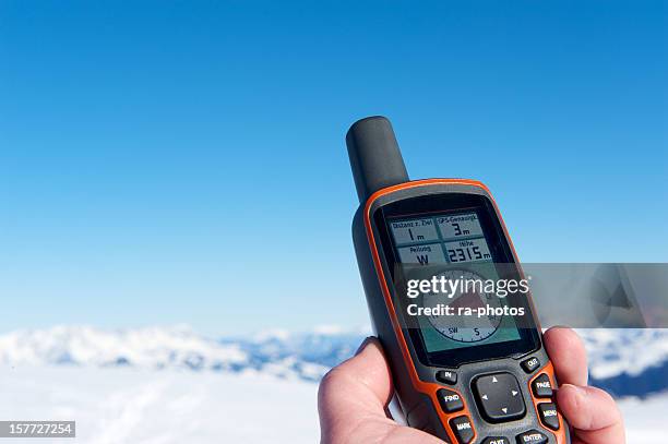 gps navigation in the mountains - geocaching stock pictures, royalty-free photos & images