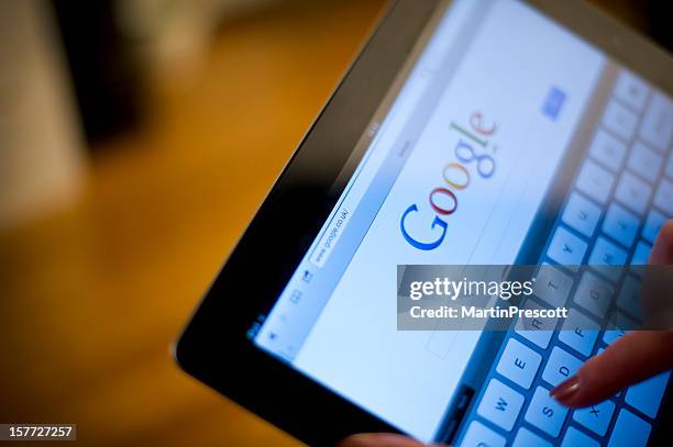 google on ipad2 screen - search engine optimisation stock pictures, royalty-free photos & images