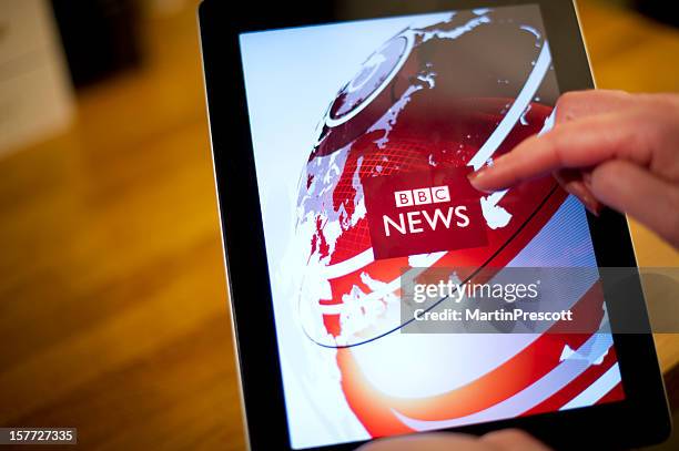 bbc news on ipad2 - bbc universal stock pictures, royalty-free photos & images