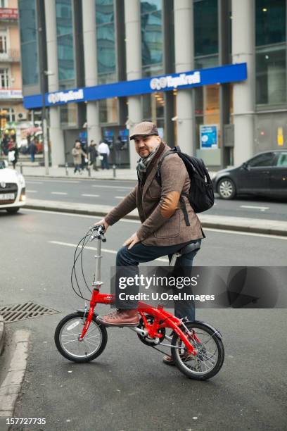 man with a folding bicycle, istanbul - foldable stock pictures, royalty-free photos & images