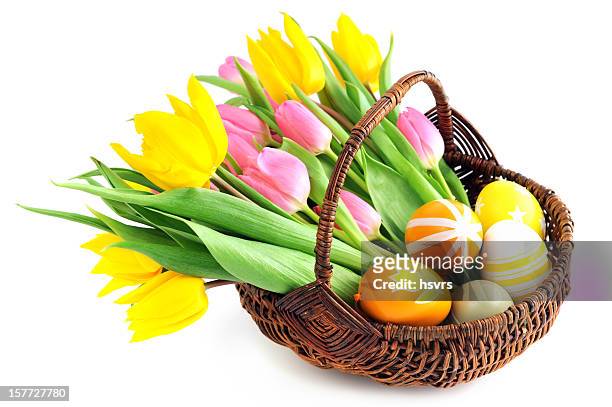 basket with bunch pink yellow tulips and eggs white background - easter egg basket stock pictures, royalty-free photos & images