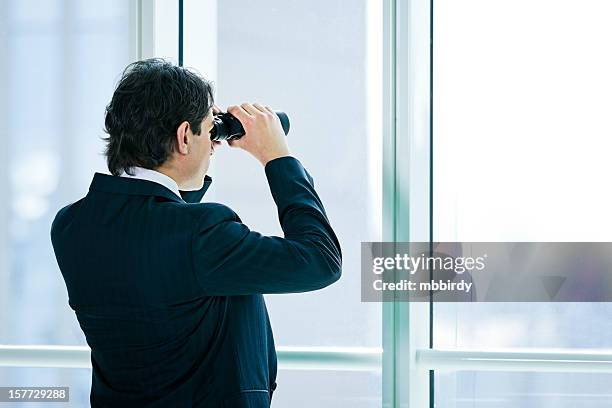 businessman with binoculars - spy glass businessman stock pictures, royalty-free photos & images