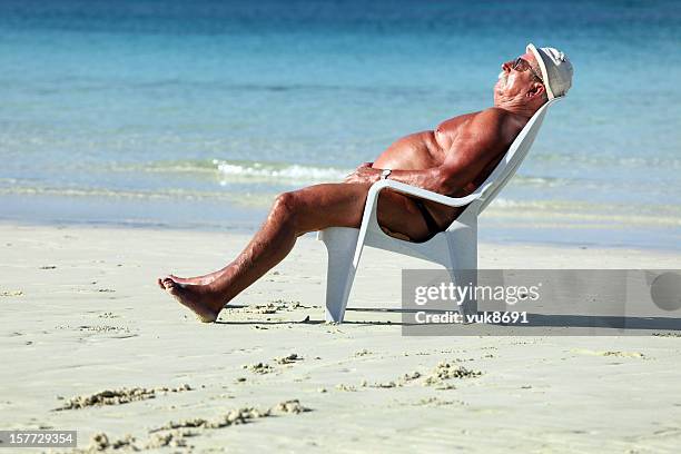 sleeping on the beach - sunbathing stock pictures, royalty-free photos & images