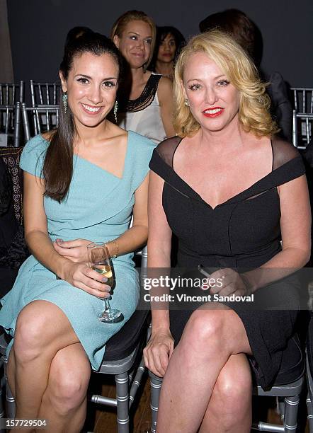 Actresses Annika Marks and Virginia Madsen attend fashion designer Kevan Hall's Spring 2013 Collection on December 5, 2012 in Los Angeles, California.