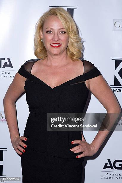 Actress Virginia Madsen attends fashion designer Kevan Hall's Spring 2013 Collection on December 5, 2012 in Los Angeles, California.