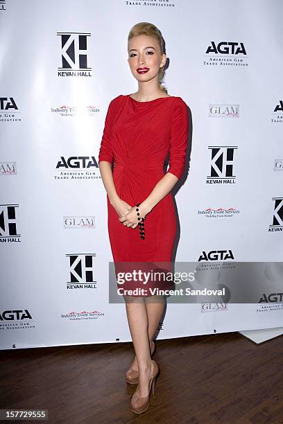 Actress Christian Serratos attends fashion designer Kevan Hall's Spring 2013 Collection on December 5, 2012 in Los Angeles, California.
