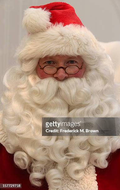 Santa Claus celebrates during The Paley Center For Media & Warner Bros. Television Unveil Lavish Holiday Window Display at The Paley Center for Media...