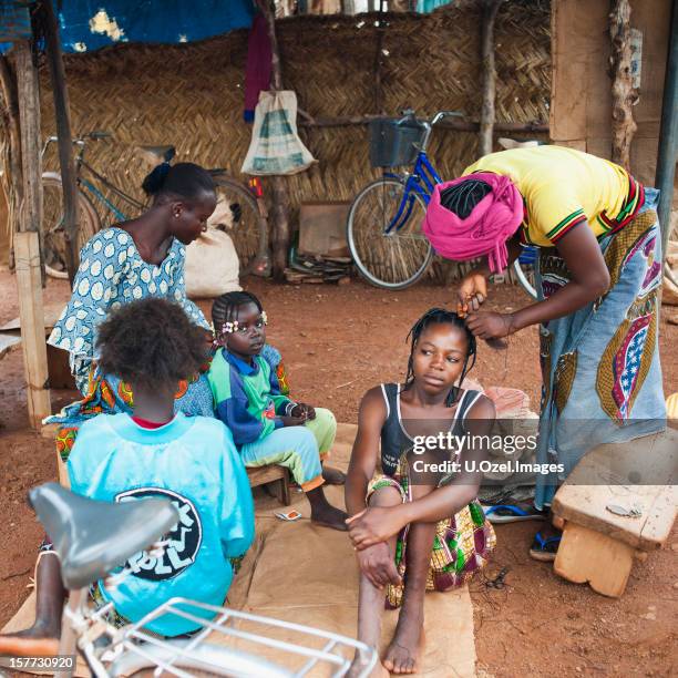 hairdresser in burkina - women in black of burkina faso stock pictures, royalty-free photos & images