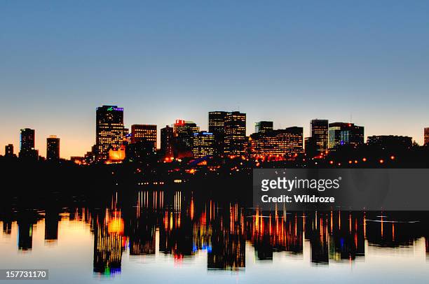 edmonton skyline at sunset reflected in river - edmonton stock pictures, royalty-free photos & images