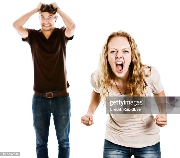 tense pair grimace and shout in excitement or anger - angry teenager stock pictures, royalty-free photos & images