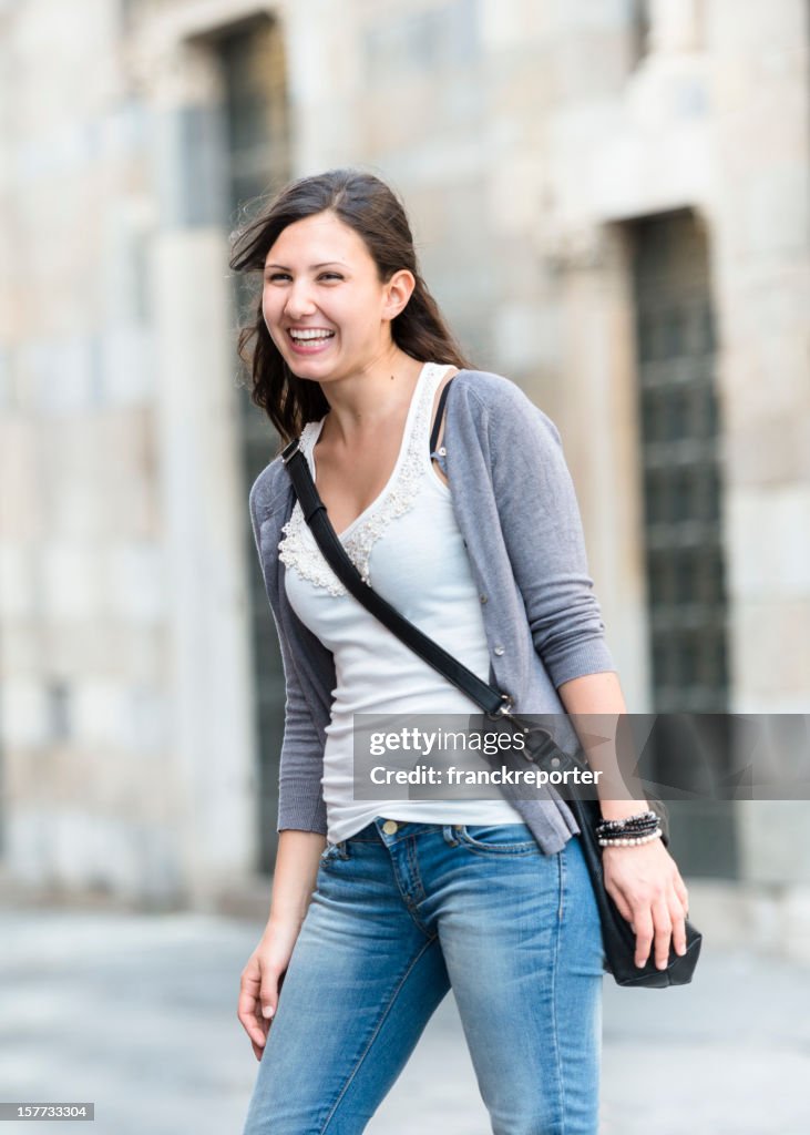 Young adult amazing woman laughing on the city