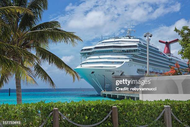 imposing carnival valor cruise ship docked at grand turk harbor - carnival cruise stock pictures, royalty-free photos & images