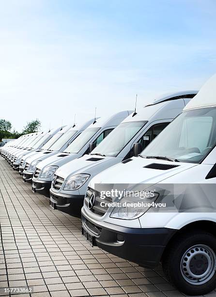 white mercedes-benz transporters in a row - trucks in a row stock pictures, royalty-free photos & images