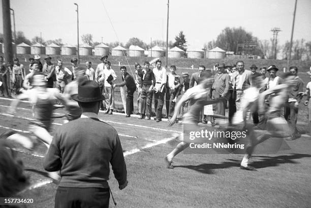 men running in high school track event 1941, retro - track and field vintage stock pictures, royalty-free photos & images