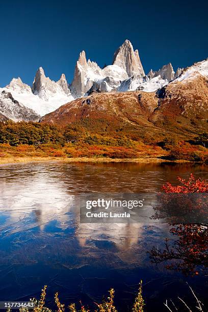 fitz roy reflected in icy pond - chalten stock pictures, royalty-free photos & images