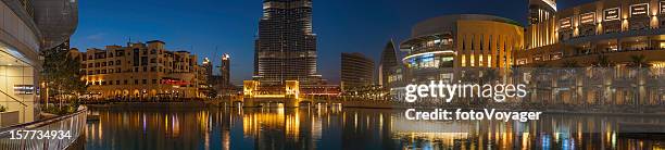 dubai mall lakeside restaurants beneath burj khalifa uae - dubai mall stock pictures, royalty-free photos & images