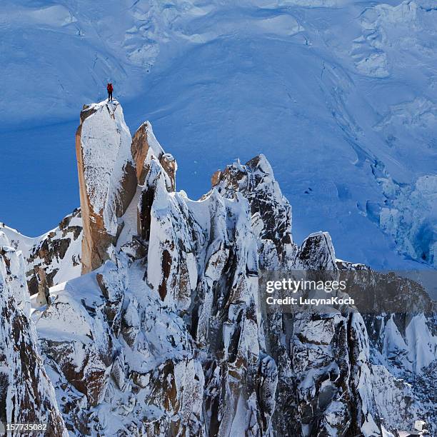 climber on mountain peak - aiguille de midi stock pictures, royalty-free photos & images