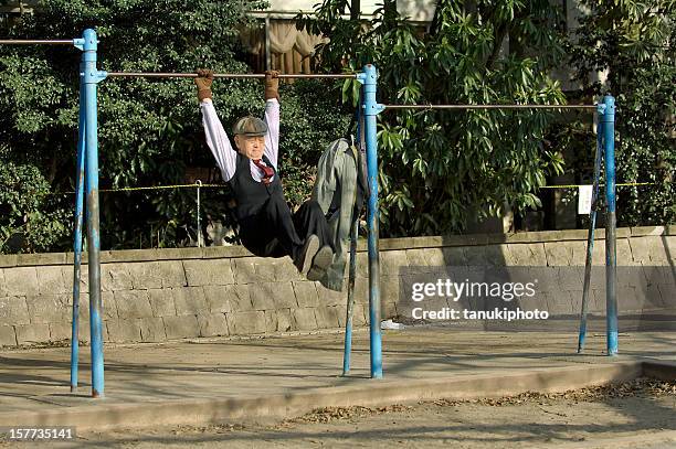fit japanese senior man - gymnastics bar stock pictures, royalty-free photos & images