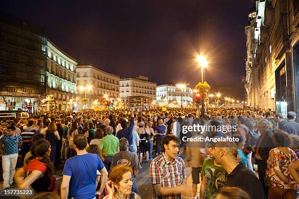 indignatos protest in puerta del sol, madrid, spain - angry group stock pictures, royalty-free photos & images
